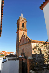 Obraz premium Parish church of the Holy Spirit (Espiritu Santo) in Fuenteheridos. Village of the Sierra de Aracena Natural Park in the province of Huelva, Andalusia, Spain