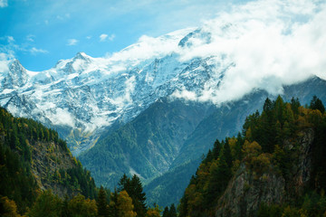 The top of the Alps Mont Blanc. Mountains in the clouds in the fog. Climate problems warming and lack of snow.