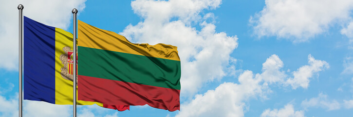 Andorra and Lithuania flag waving in the wind against white cloudy blue sky together. Diplomacy concept, international relations.