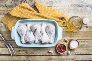 Raw organic chicken legs with ingredients
