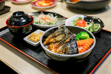 Saba fish grilled with teriyaki sauce and rice, focus selective.