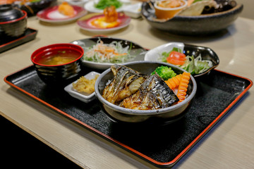 Saba fish grilled with teriyaki sauce and rice, focus selective.