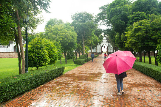 Woman holding an umbrella travel in rainy days