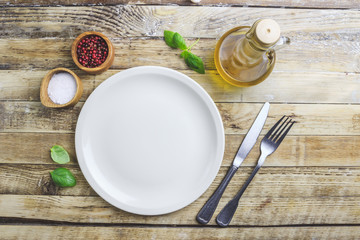 Elegant empty plate, cutlery and napkin