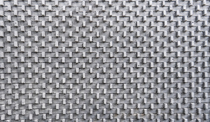 Grey brick arranged in three dimensional wall for outdoor decoration as illusional pattern.