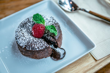 chocolate lave and raspberry fruit and pepper mint dessert in coffee cafe