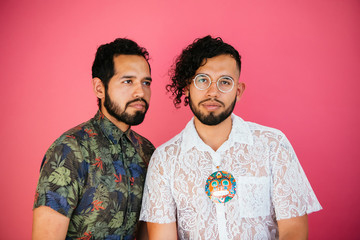 Portrait of Latino twin brothers in studio environment