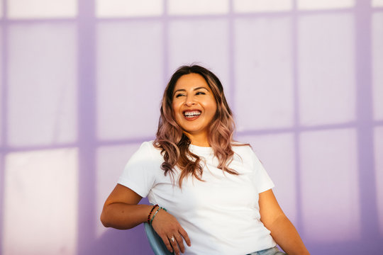 Portrait Of Young Latina Woman In Studio Environment