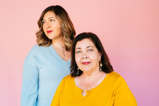 Portrait of Latina mother and daughter in studio environment