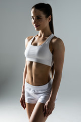 Fototapeta premium Slim waist of young sporty woman. Detail of perfect fit female body