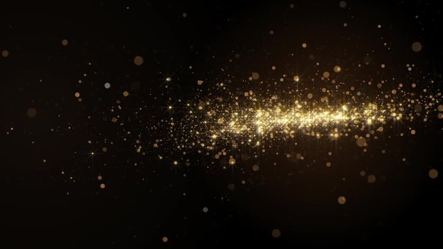 Abstract video background with golden light bokeh particles in motion.