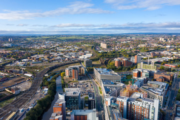 Fototapeta na wymiar Aerial photo of the Leeds town centre in the UK showing train tracks along the city centre