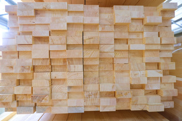 Stack of two-layer wooden glued laminated timber beams from pine finger joint spliced boards