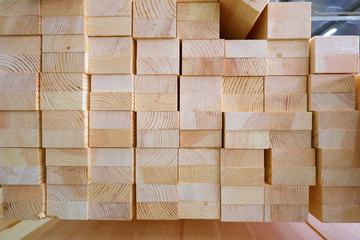 End view of stack of two-layer wooden glued laminated timber beams from pine finger joint spliced boards