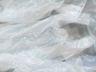 Many overlapping white plastic bags