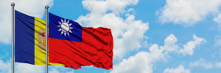 Andorra and Taiwan flag waving in the wind against white cloudy blue sky together. Diplomacy concept, international relations.
