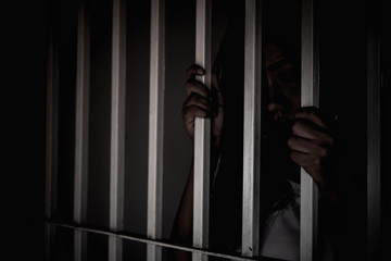 Hands of women desperate to catch the iron prison,prisoner concept,thailand people,Hope to be...