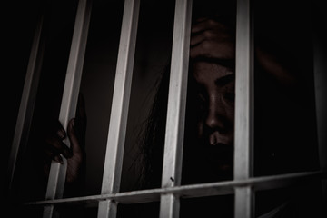Hands of women desperate to catch the iron prison,prisoner concept,thailand people,Hope to be...