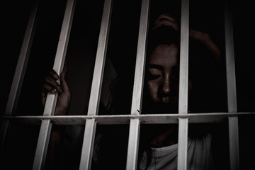 Hands of women desperate to catch the iron prison,prisoner concept,thailand people,Hope to be...