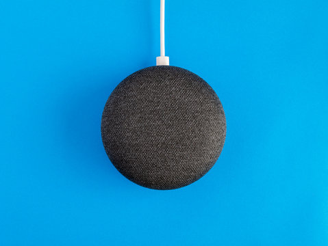 Smart home device speaker on blue background