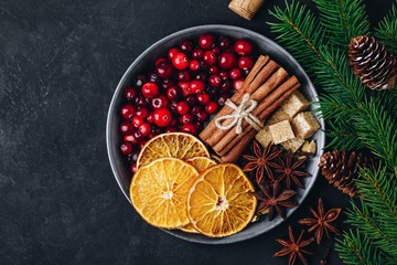 Homemade Mulled Wine recipe. Mulled Wine Ingredients with cranberries, oranges, cinnamon, anise and cardamom - Powered by Adobe