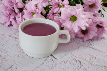 beautiful, purple flowers and a cup of tea.
