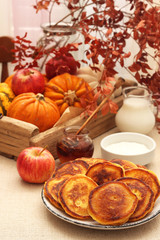 Pumpkin pancakes with cinnamon and honey