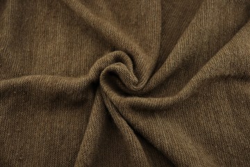 Knitted brown wool scarf wrapped clockwise.