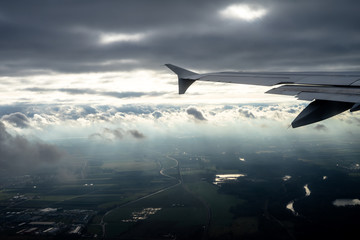 airplane flying over the clouds