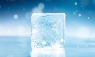 The frozen ice cube on ice desk with an abstract illustration