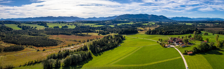 Fototapeta na wymiar Aerial Alpenvorland landscape Bad Toelz Blomberg with Mountain Range Alps in the back. Bavaria, Germany, Alps