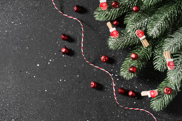 Christmas background decorated with wooden mittens on clothespins. Top view with copy space