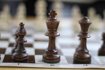 Black Chess pieces. Moving the pieces in chess game. Beautiful chess combinations. Stock photo