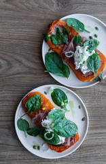 Roasted pumpkin with ricotta cheese, serrano ham, spinach and onion. Food photography Food. Top view.