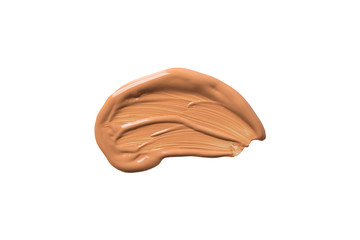 Smeared stroke of brown bronze tone liquid cover up foundation for face skin isolated on white background. Make up fashion beauty concept