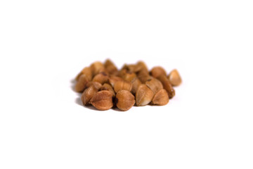 Buckwheat groats closeup on a white background with blur background