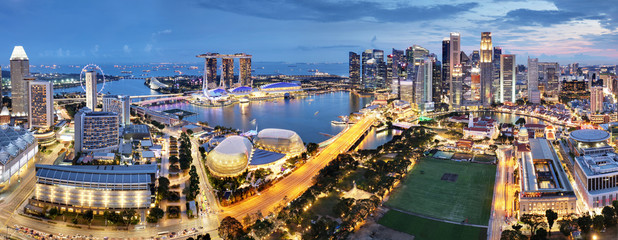 Plakat Aerial view of Singapore business district and city at twilight in Singapore, Asia