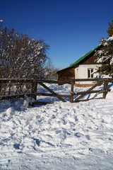 Winter house on winter snowy panoramic landscape