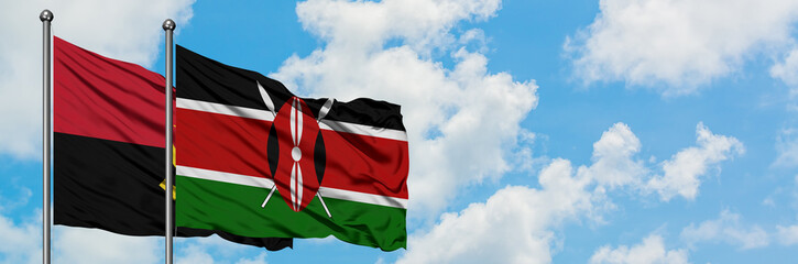 Angola and Kenya flag waving in the wind against white cloudy blue sky together. Diplomacy concept, international relations.