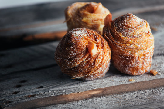 Fresh baked cruffins trend pastry on rustic wood