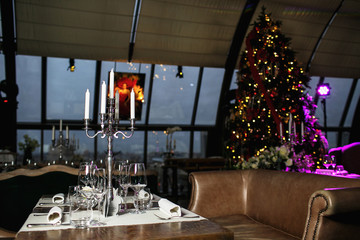 catering at a top event, glasses and flowers on the table, preparation for a significant event, beautiful dishes and glasses on the table, New Year's holiday table