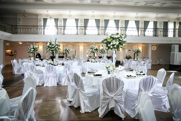 catering at a top event, glasses and flowers on the table, preparation for a significant event, beautiful dishes and glasses on the table, New Year's holiday table