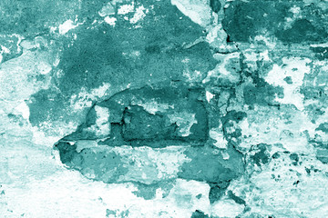 Old grungy brick wall texture in cyan tone.