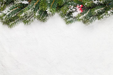 Obraz na płótnie Canvas Christmas card with fir tree over snow