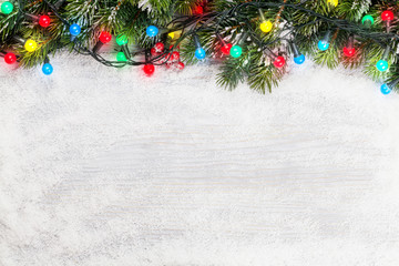 Fototapeta na wymiar Christmas card with fir tree and colorful lights