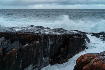 Fototapeta premium Stormy waves at Barents Sea, Arctic Ocean. Kola Peninsula, Murmansk region in Russia