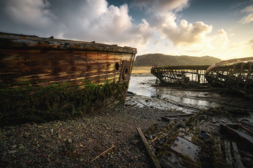 Abandoned ships cemetery at low tide near Teriberka village in Murmansk Region. Kola peninsula, Northern Russia