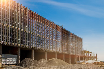 Construction site background. Hoisting cranes and new multi-storey buildings. I.ndustrial...