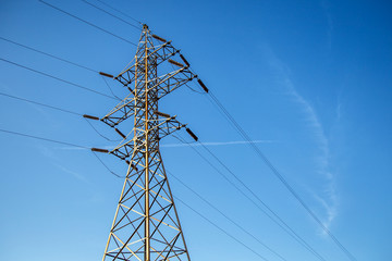 High-voltage power lines.Electricity pylon.Power Tower.Distribution electric substation with power lines and transformers.Electricity transmission power lines at sunset