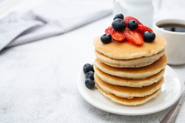 Pancakes with berry breakfast or snack, isolated on white background, copy space for text.